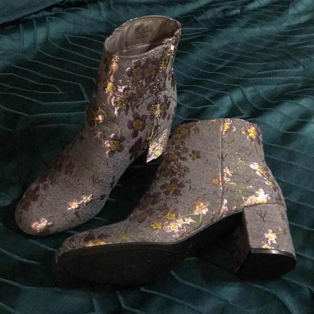 Cute little booties! That have embroidery on them. They fit into any style.